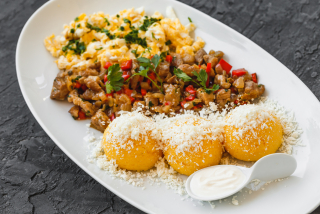 Moldavian Mamaliga with pork stew with omelette