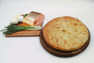 Ossetian pie with smoked fish, egg and green onions