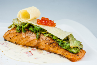 Salmon in cream sauce with grilled lettuce