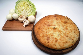 Ossetian pie with fresh cabbage and mushrooms