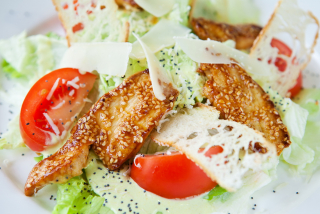 Caesar salad with wasabi sauce and chicken