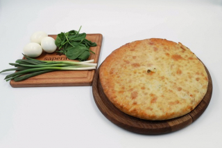 Ossetian pie with egg, spinach and green onions